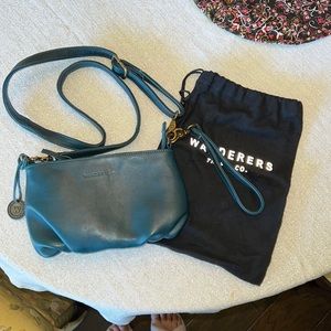 Wanderers Travel Co. cross body bag.  This is a dark teal bag.